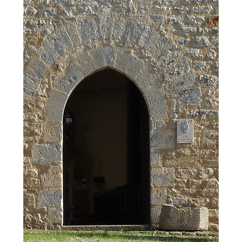 is the planter on the south side of the door a former font?
