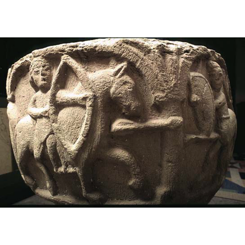 a battle between a man on horseback with a bow and arrow against a centaur holding a large shield and possibly a sword; there are two arrows on their way to the centaur (!) -- on the underside of the bowl is a vegetal motif