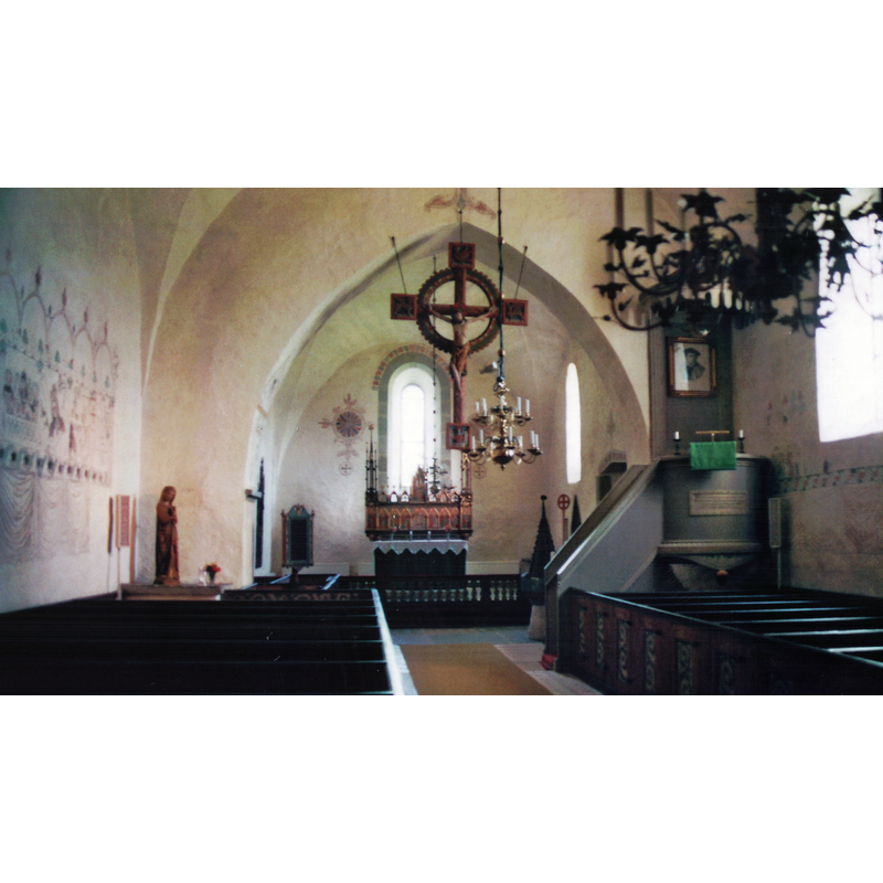 the font and cover are partially visible at the far [east] end, beyond the pulpit stairs; the Sundre Madonna stands at the northeast corner of the nave