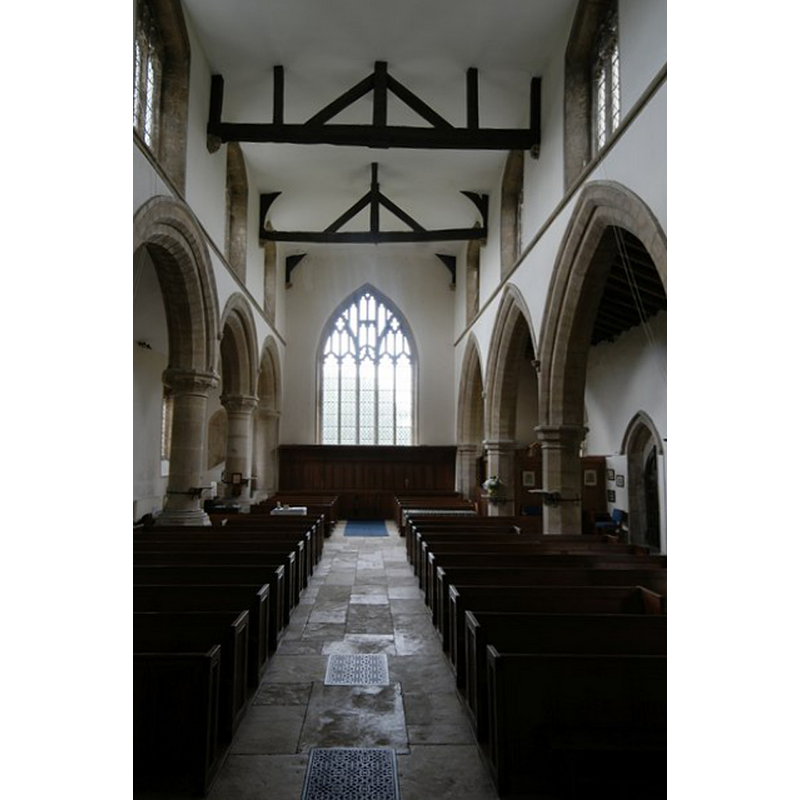 Source caption: "St Andrew's Church: The Nave. We are looking down the years here. The arches on the left are 12th century Norman, those on the right 13th century Early English. The clerestory above, with its windows, is 15th century; yet the tracery of the west window is Perpendicular, from the 14th. The roof and plastered ceiling is by local joiners Smith, Dale and Sandy in 1818 and the pews by A N Prentice in 1907."