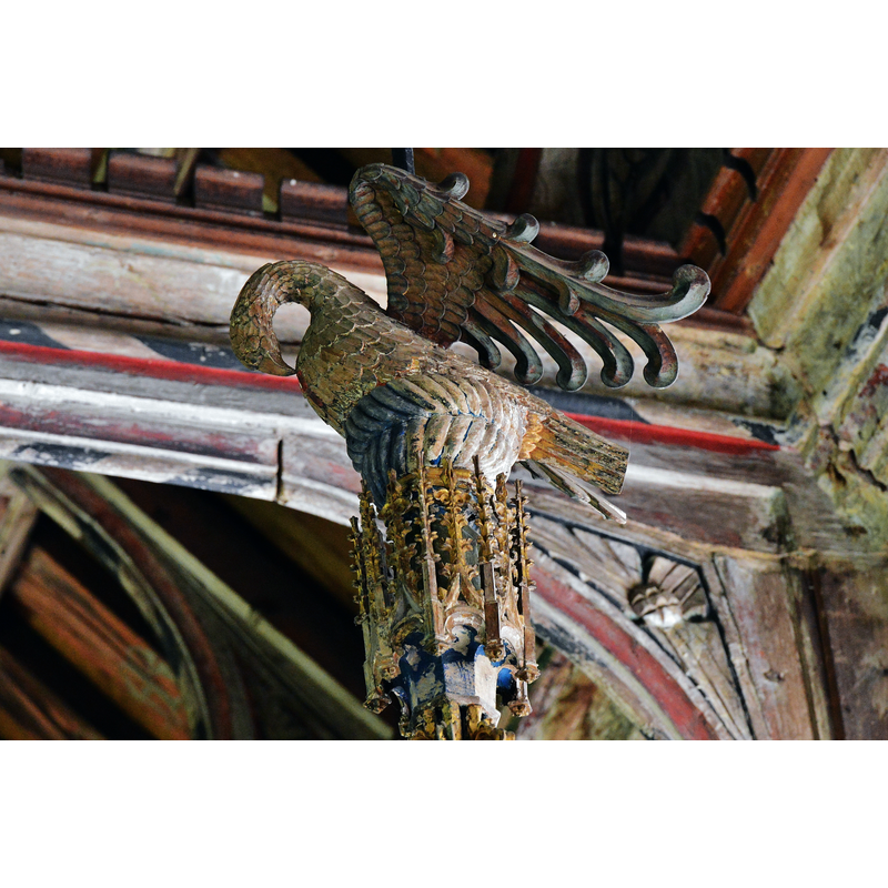 Source caption: "Ufford: St. Mary of the Assumption Church: The font cover. Dating from around 1450, this is the pelican in her piety picking at her breast to feed her young with her own blood; symbolising Christ shedding His blood for us. The towering font cover means that the pelican in her piety is 18 feet above the font."