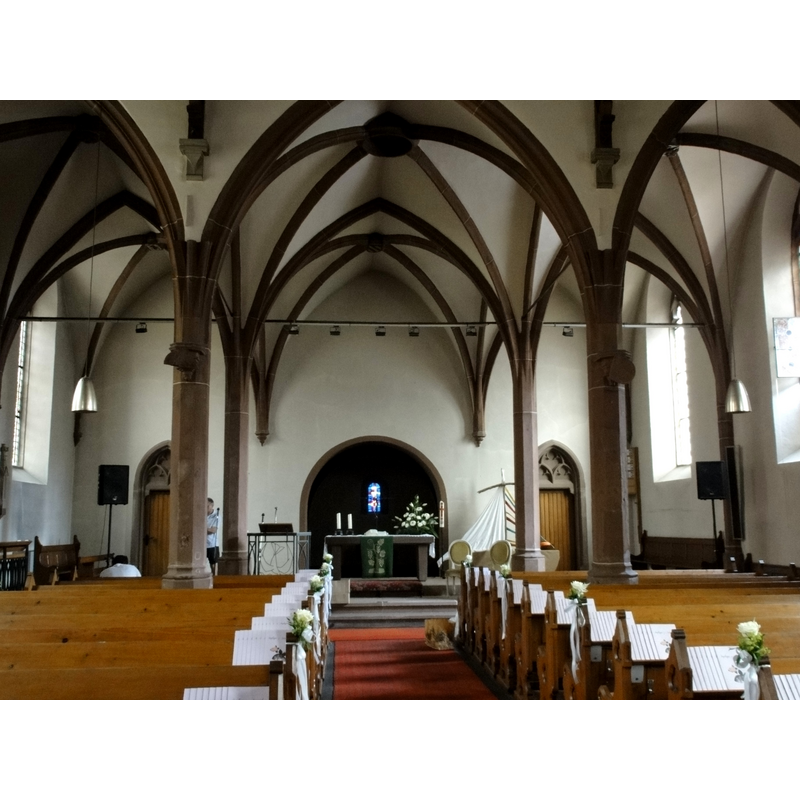the space beyond the altar and the round arch must be the east tower