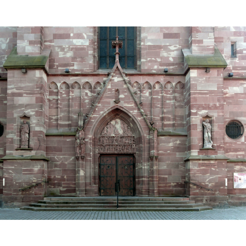 the neo-Gothic tympanum illustrates the life of St Peter, to whom the church is dedicated