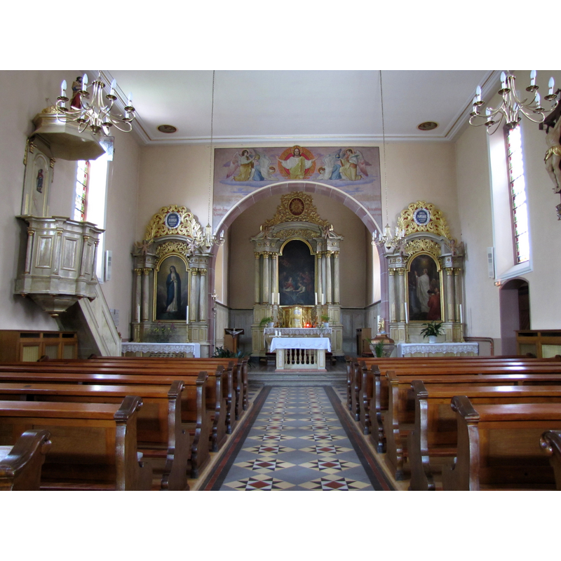 the top of the font is visible on the right [south] side, at the far [east] end of the nave