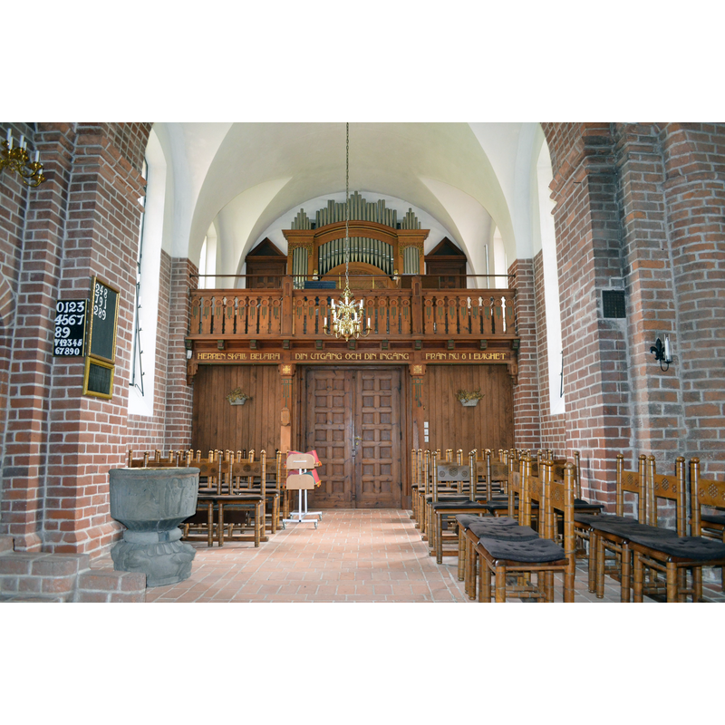 the font in the foregrouund; the south transept and the organ behind