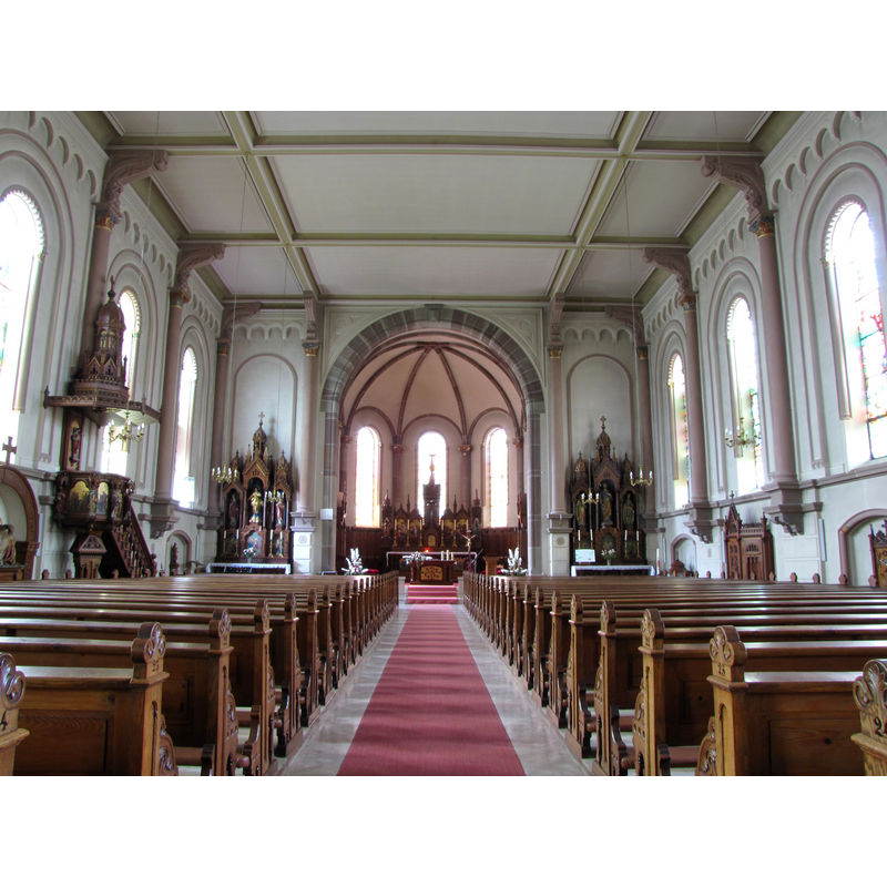 the top of the font cover is visible in the eastern-most alcove of the right [south] side, between the confessional and the south side altar