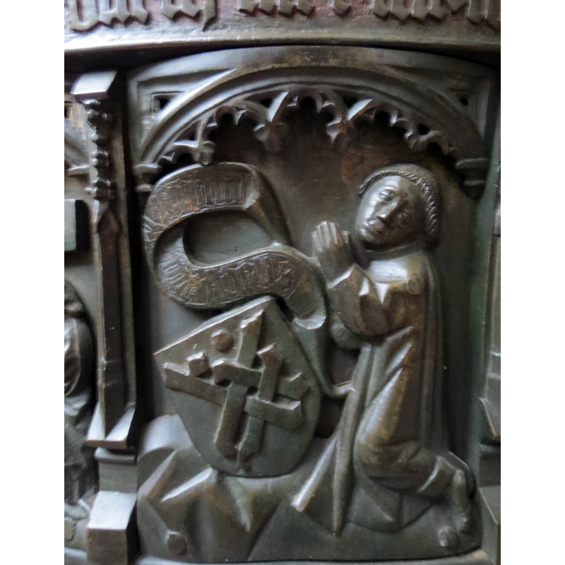a priest ca. 1450, probably the donor of the font