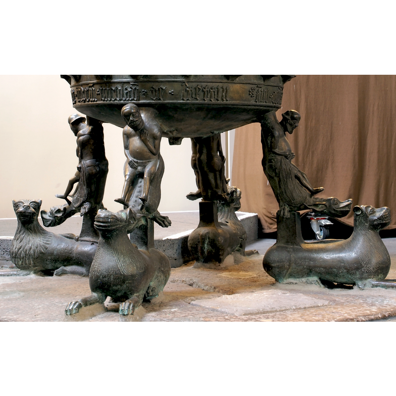 saurian-like, serving as seats to the figures on them