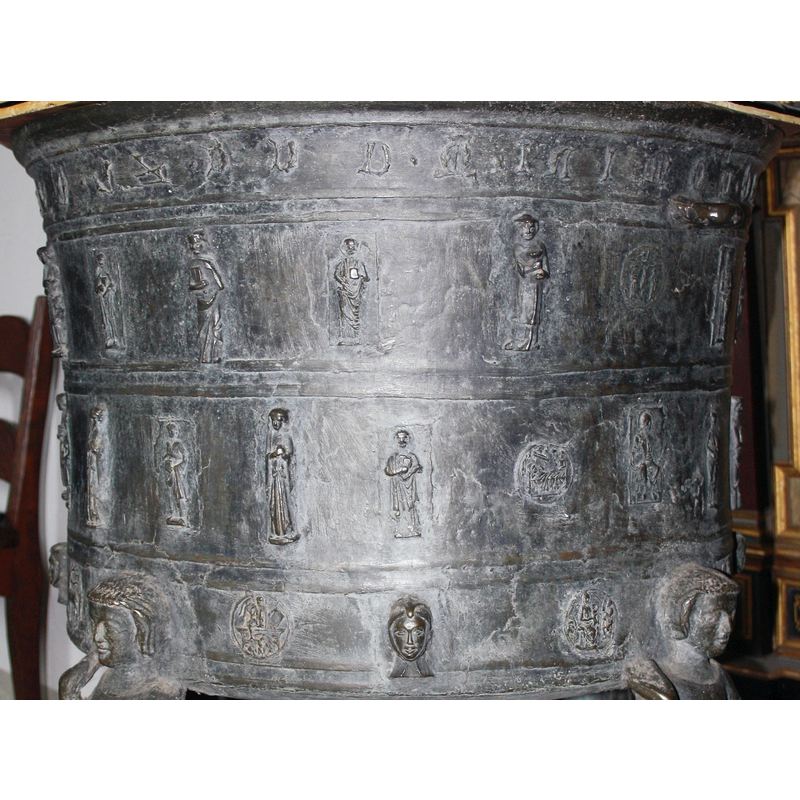 a number of them, probably apostles; some of them hold a book, one other a large cup or chalice, etc.