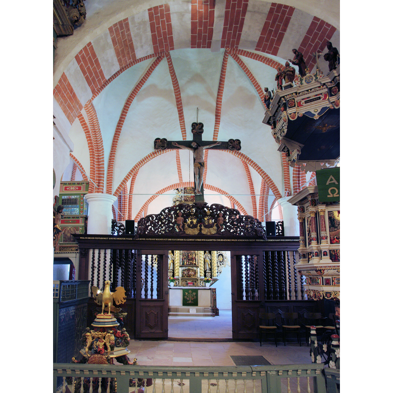 showing the east end of the nave, the chancel screen and the reredos, the painted ceiling of the chancel, the main altar and retable