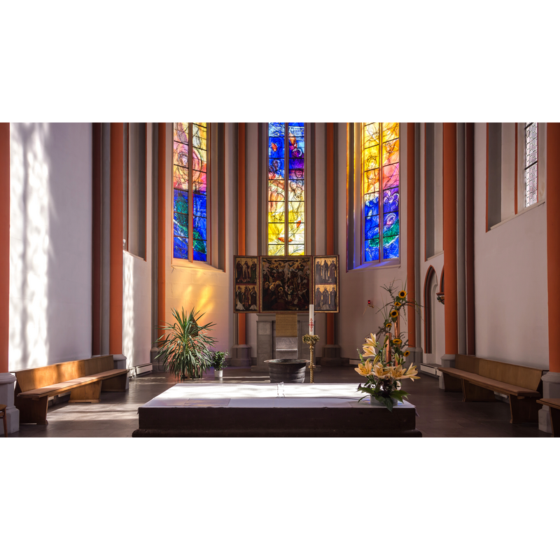 the top of the basin is visible right behind the altar, in the centre of the chancel