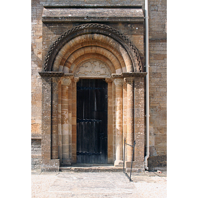 Source caption: "Milborne Port: Norman south doorway. At St John's church and dating from the eleventh or twelfth century".