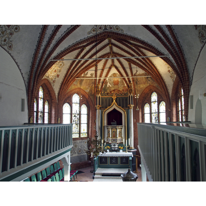 the covered metal font is partly visible in the foreground, toward the right [south] side