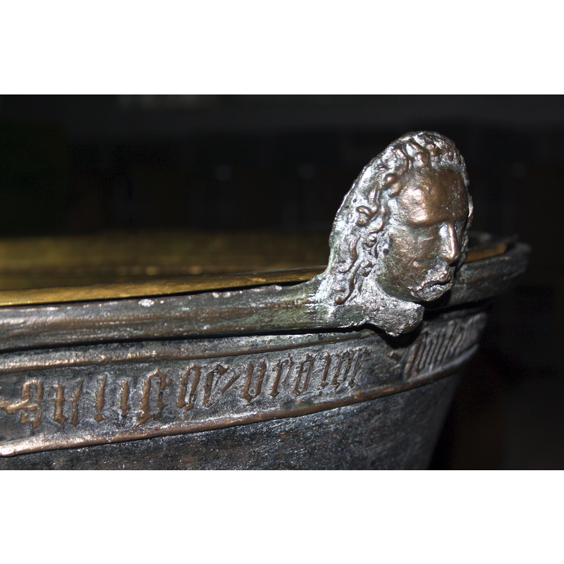 the anchoring spot for the original font cover lock -- Source caption: "Detail of the baptismal font in Marienkirche Norderbrarup, Schleswig-Holstein, Germany, cast in 1486 by Peter Hansen".