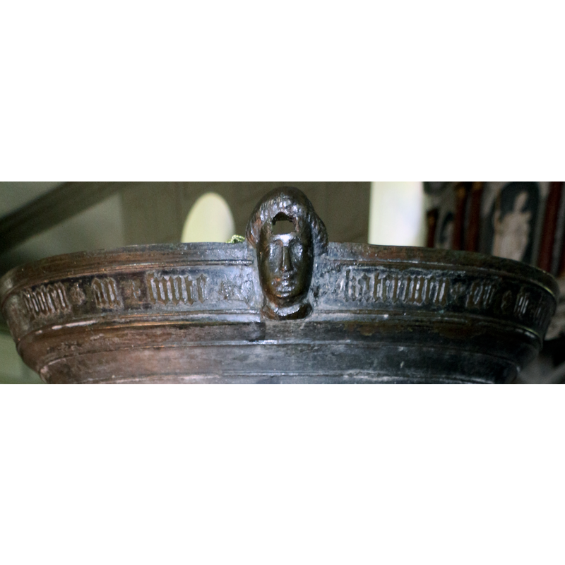 protruding from the upper rim of the basin; was the anchoring point for the original font cover