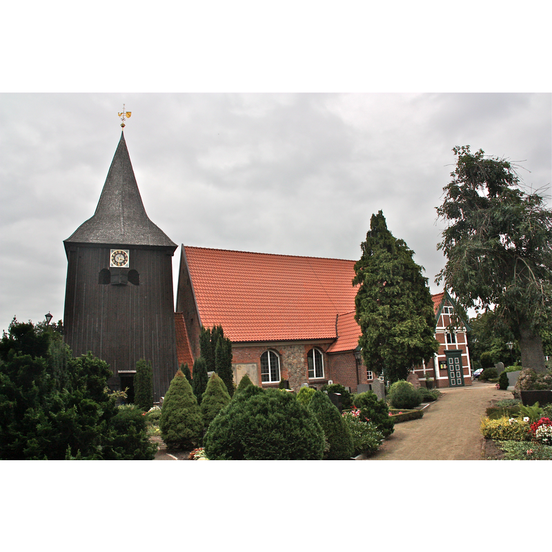 the formerly detached bell-cote is now linked to the church by a short covered passage