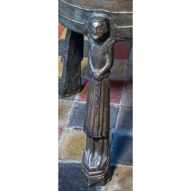 on little moulded platforms; are they clerics? there is a halo-like shape at the back of their heads but is may be a trace of the attachment to the basin side