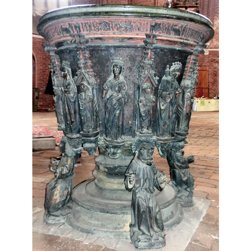 the larger figures appear to be all crowned females; one of them holds a church building