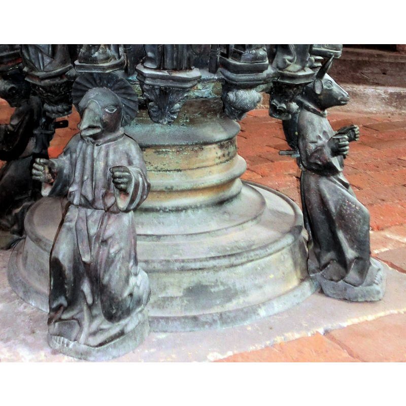each has the head of his symbol; John and Luke -- the may have originally held a scroll in their hands