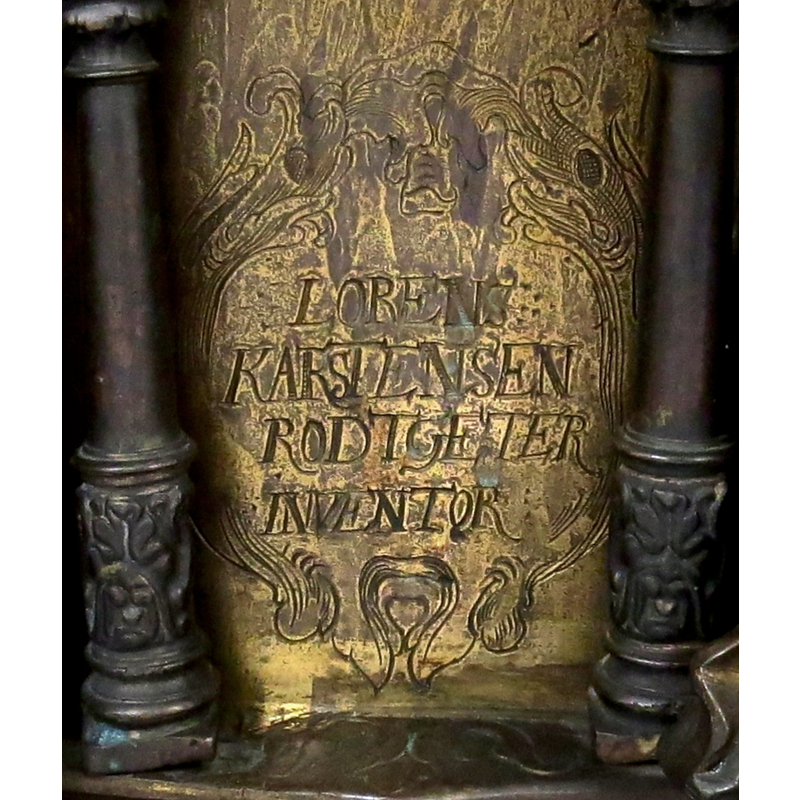 in one of the arches on the basin side; the name of the maker