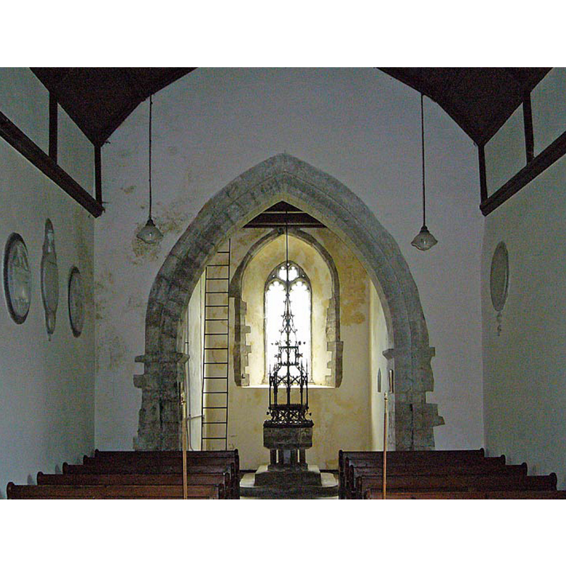 the font and its modern cover beneath the tower
