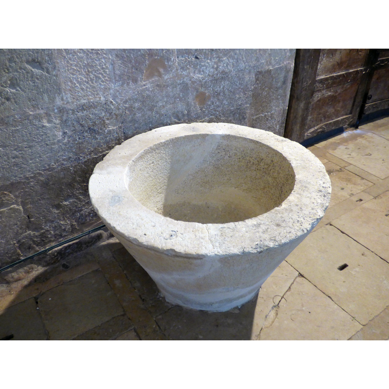 the old font, now [May 2018] repaired and re-located inside the church; since there is another font in use in this church [cf. FontNotes] it has been located inside the south entranceway, the foor of which is visible here on the right