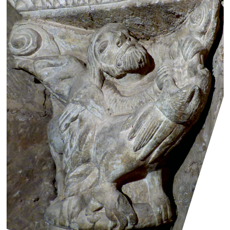 one of two figural capitals behind the retable; this one of Samson [confirmed by Juan Antonio Olañeta in 2018] [distorted detail by BSI of the original 2018 photograph by Juan Antonio Olañeta]