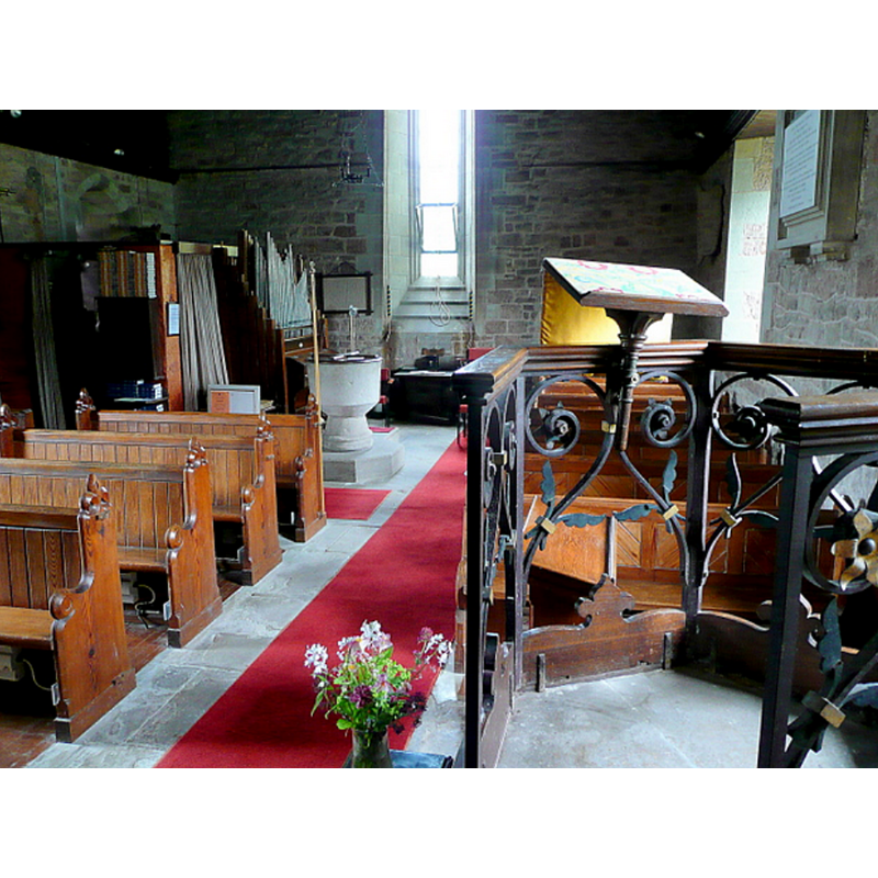 with the font and cover at the far [west] end, left [south] side