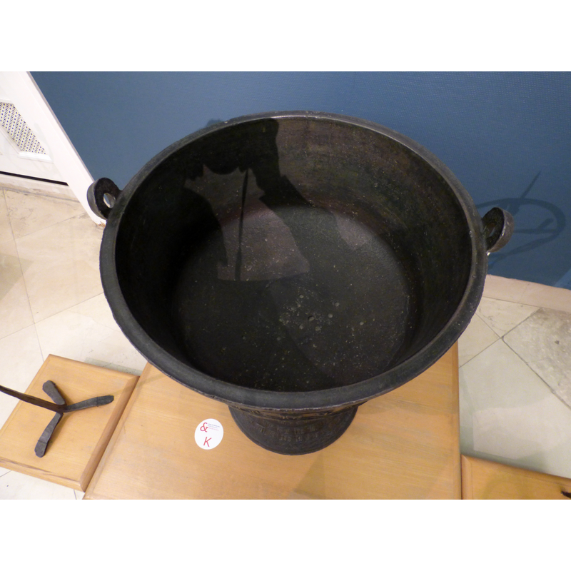 the handle-like rings at opposite end of the upper rim were probably associated with the font cover locking system
