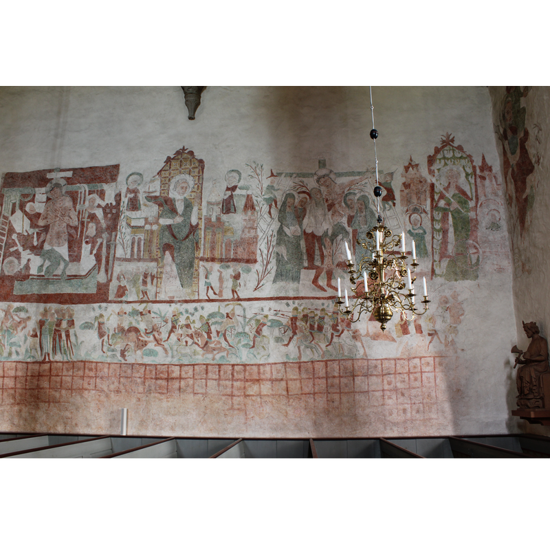 at the right end of the image is a statue of St. Olaf and the west side of the chancel arch