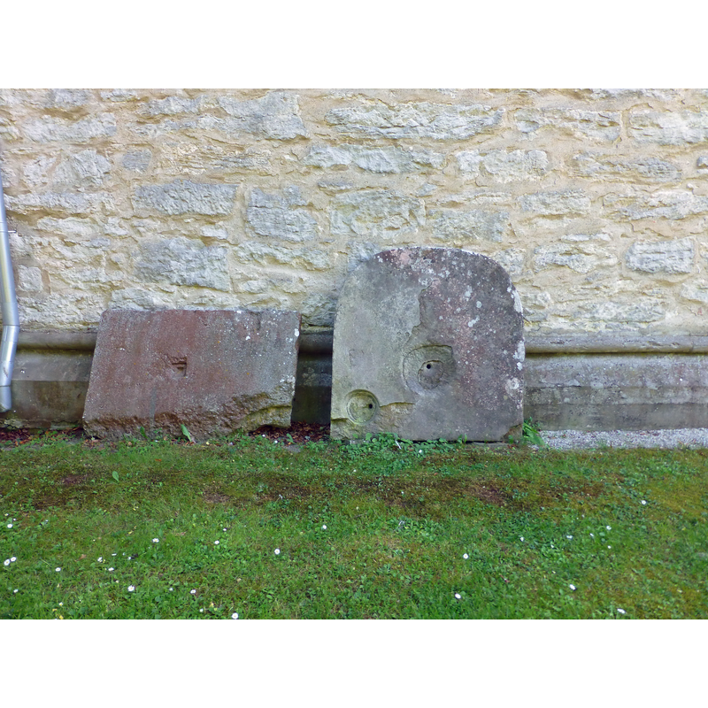 the one on the right may have been the plinth of an old font or piscina