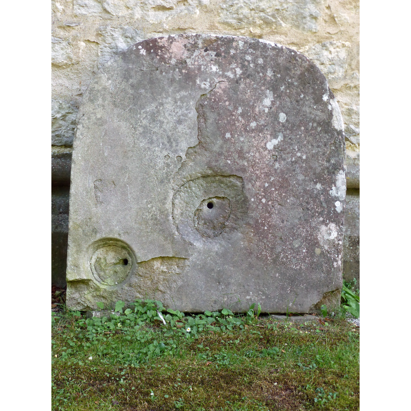 the plinth of an old font or piscina?