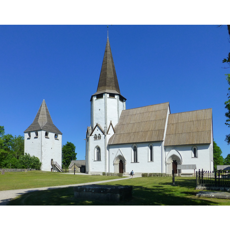 the detached tower to the west of the church is what remains of the original Romanesque church here; some elements of the old church were integrated into the present church, a late-13thC Gothic building