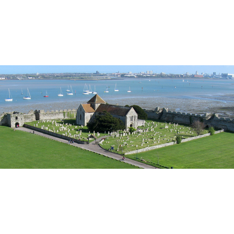 Source caption: "The 12th-century church within the outer bailey of Portchester Castle was founded for the priory. It is now the parish church."