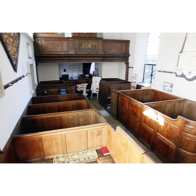 Source caption: "View from the pulpit in St Mary Avington showing the box pews in the church" [and the modern font at the west end]