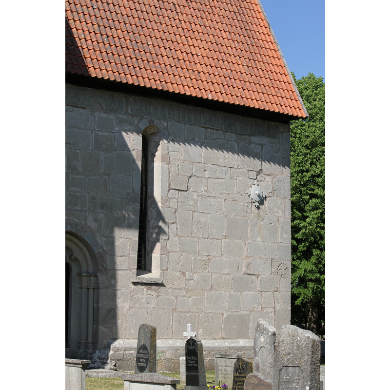 partial view of the southeast portal; the wall area directly under the roof is covered in medieval friezes