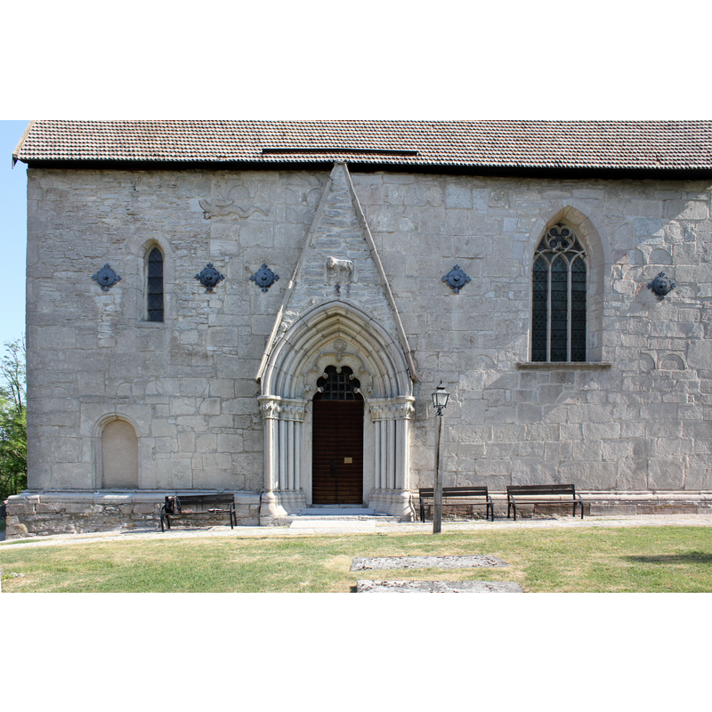 showing the main southwest portal on the right, and a smaller blocked portal on the left -- was the smaller portal the nave entrance in the earlier church?