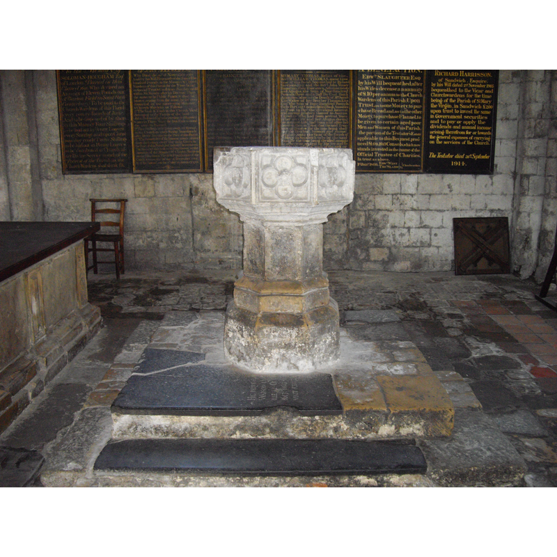 Source caption: "The Font in St Mary's Church, Sandwich. The Font has on it, the Arms of France, quartering England; on another shield, a Merchants mark; on another, the Arms of the Cinque Ports; on the fourth the arms of ELLIS; the other sides, mouldings, etc. are ornamented with roses, satyrs heads, and niches."