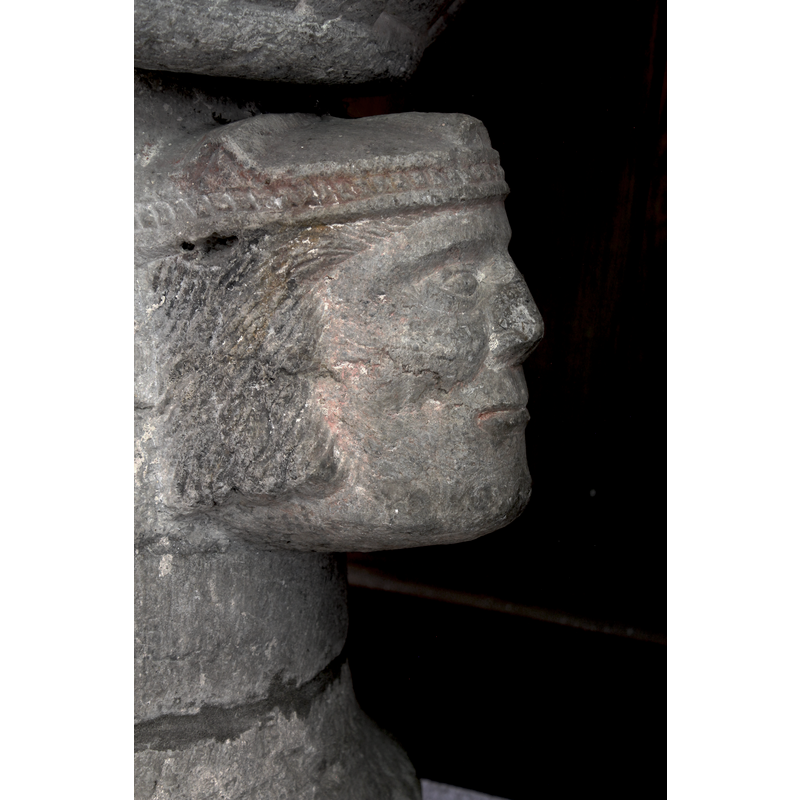 no facial hair but wearing long hair to the jowl -- on the west-northwest side of the base
