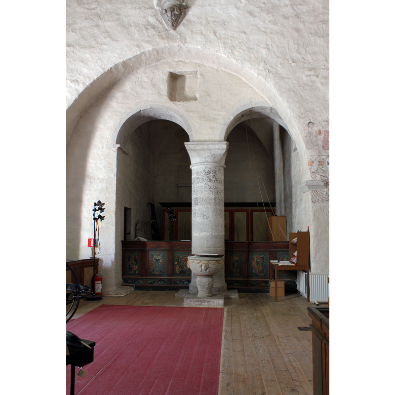 the late font at the west end of the nave