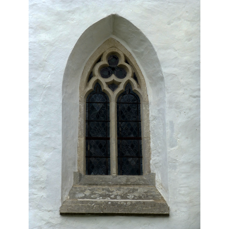 opening into the west wall of the nave, north side