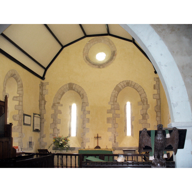 Source caption: "Inside All Saints, Long Sutton. View towards the Norman windows on the east wall of the village's 13th century church."