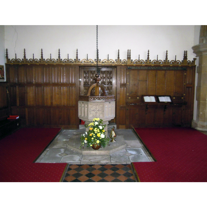 the modern font at the west end of the nave, beneath the gallery