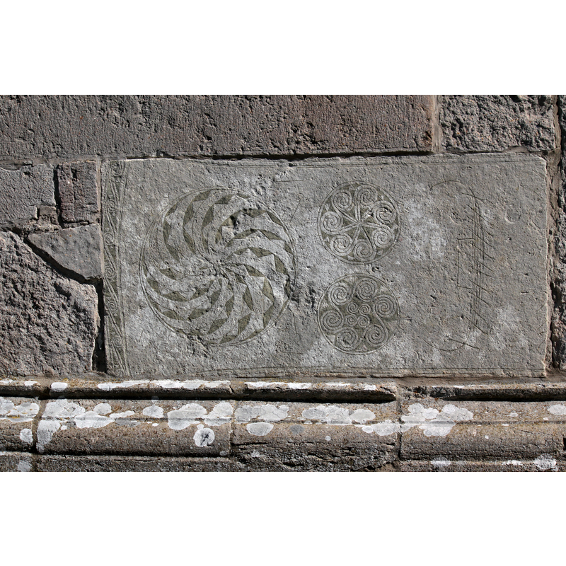 probably a tombstone re-used on this side, to the left of the southwest portal; the incision on the right appears to be a Viking-type ship