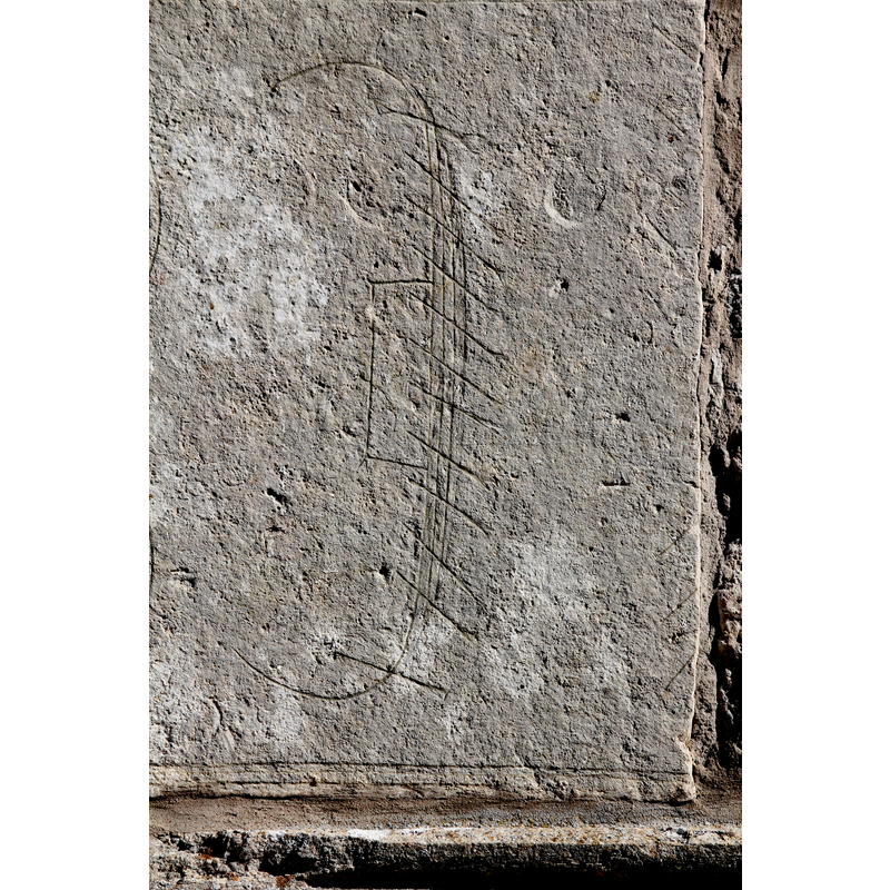 probably a tombstone re-used on this side, to the left of the southwest portal; the incision visible here appears to be a Viking-type ship