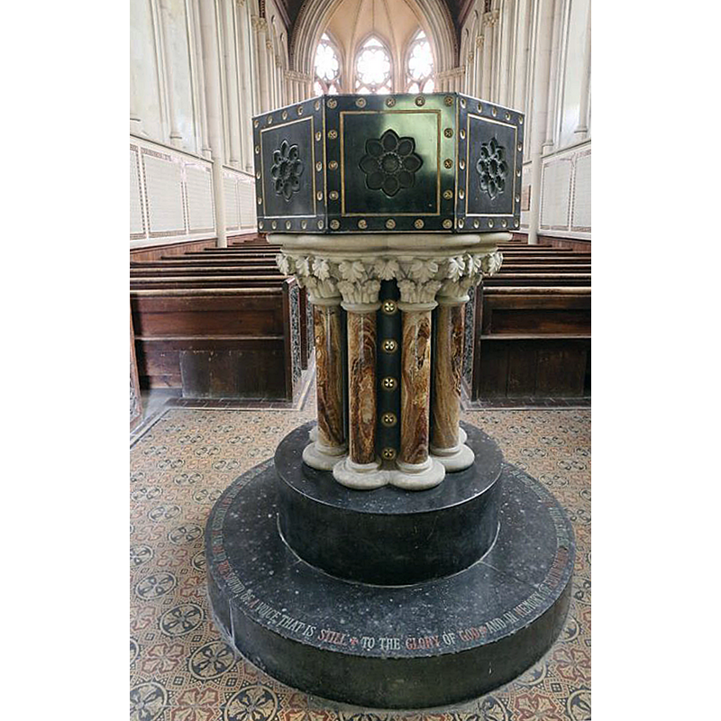the modern font in the church of 1866, the third on this site -- Noted in Historic England: "font of coloured enamel gilt bronze and black Californian marble" [cf. FontNotes]