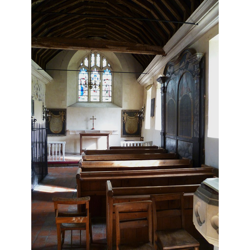 church originally 13thC; interior re-done in early 18thC; it is now redundant -- a part of the modern font is visible in the foreground, right side