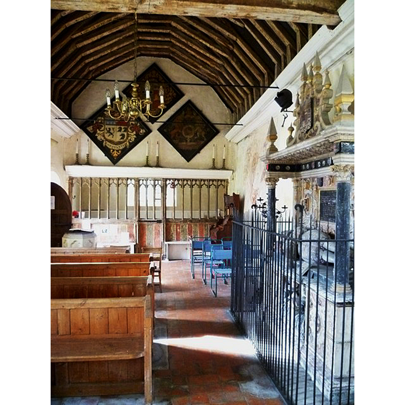 church originally 13thC; interior re-done in early 18thC; it is now redundant -- the modern font is partially visible at the back, left side, by the south entranceway