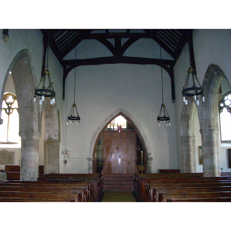 the top corner of the font is visible on the left here, before the round pillar of the south arcade