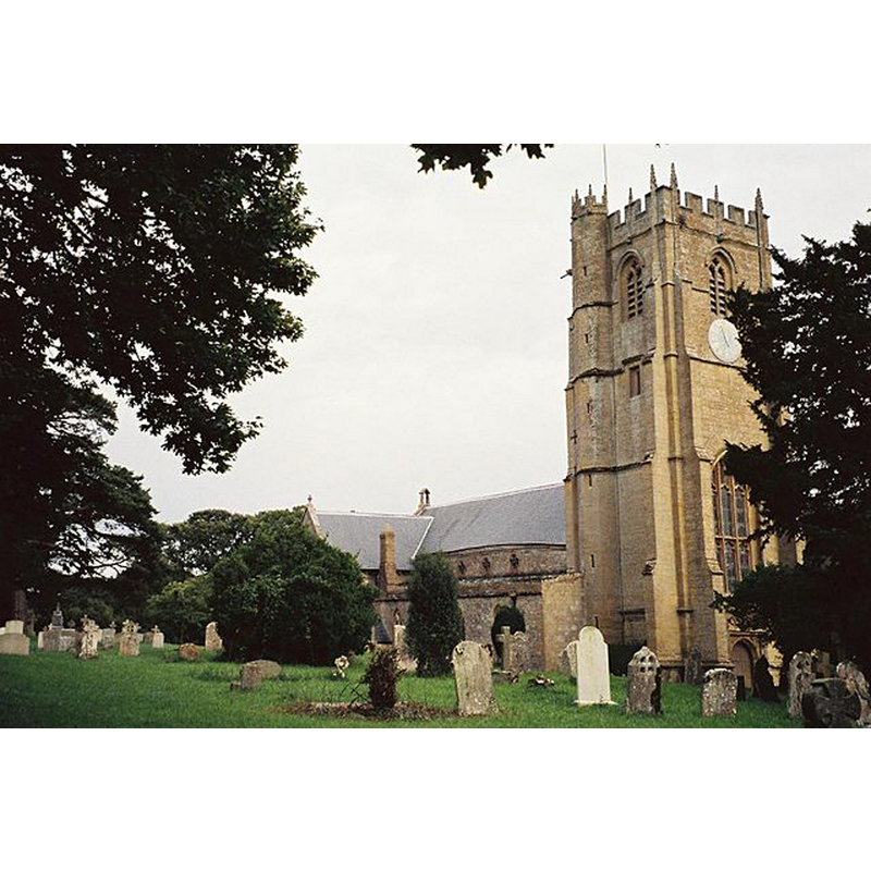 Source caption: "Whitechurch Canonicorum: parish church of St. Candida and Holy Cross. This building represents two linguistic alternatives – firstly, the village name is Whitchurch Canonicorum (no 'e') while the parish is Whitechurch Canonicorum (with an 'e'); and secondly, the name derives not from the fact that the church is white (it isn't) but because St. Candida is also known as St. Wite. The church is mainly 13th century (the south doorway is 12th while some interior parts are 15th, including the tower), while it is particularly unusual in that it contains the shrine of the saint to whom it is dedicated. All shrines were ordered to be destroyed during the Reformation so this is indeed a rare survival. Because of its relative size it is known as the cathedral of Marshwood Vale."